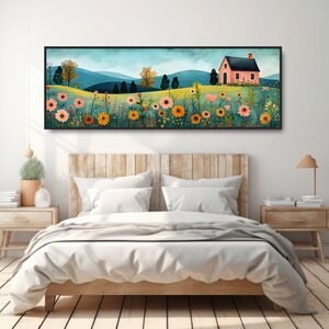 May include: A framed illustration of a pink house with a green roof in a field of colorful flowers. The house is surrounded by a field of flowers in shades of pink, yellow, orange, and red. The background is a blue sky with green hills.
