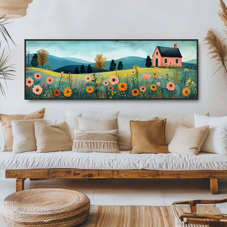 May include: A long, horizontal painting of a pink house with a green roof in a field of colorful flowers. The house is surrounded by a field of flowers in shades of pink, orange, yellow, and red. The background is a blue sky with white clouds and green hills.