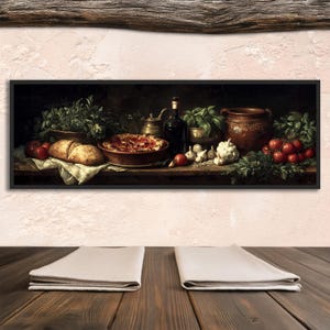 May include: A framed still life painting depicting Italian food. The painting shows a loaf of bread, a pizza, tomatoes, garlic, herbs, and a bottle of wine. The painting is set on a wooden surface.