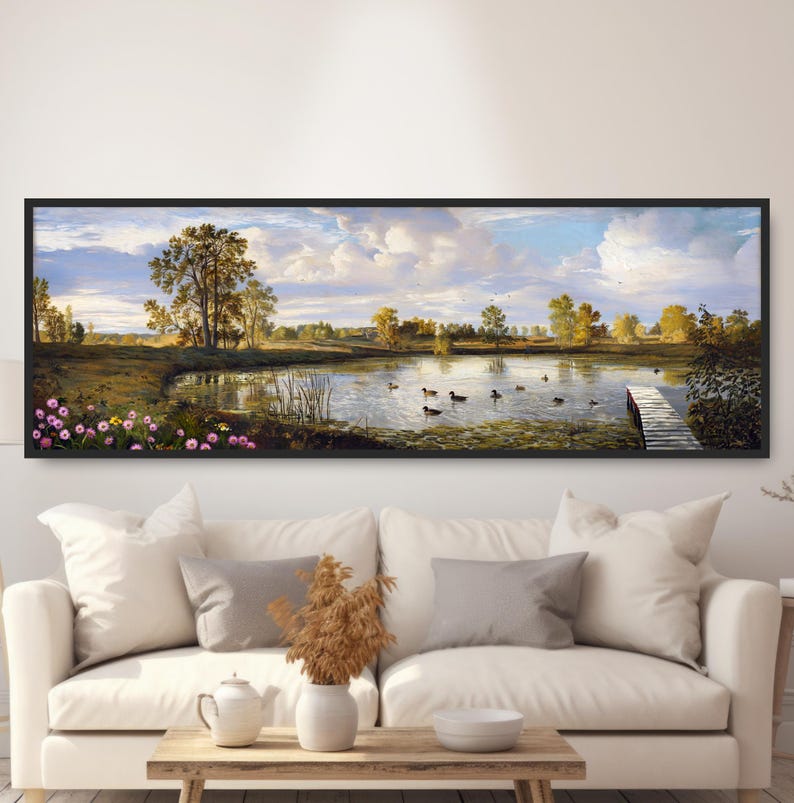 May include: A panoramic landscape painting depicting a serene lake with ducks swimming in the water. The lake is surrounded by trees and a wooden dock extends into the water. The sky is blue with white clouds.