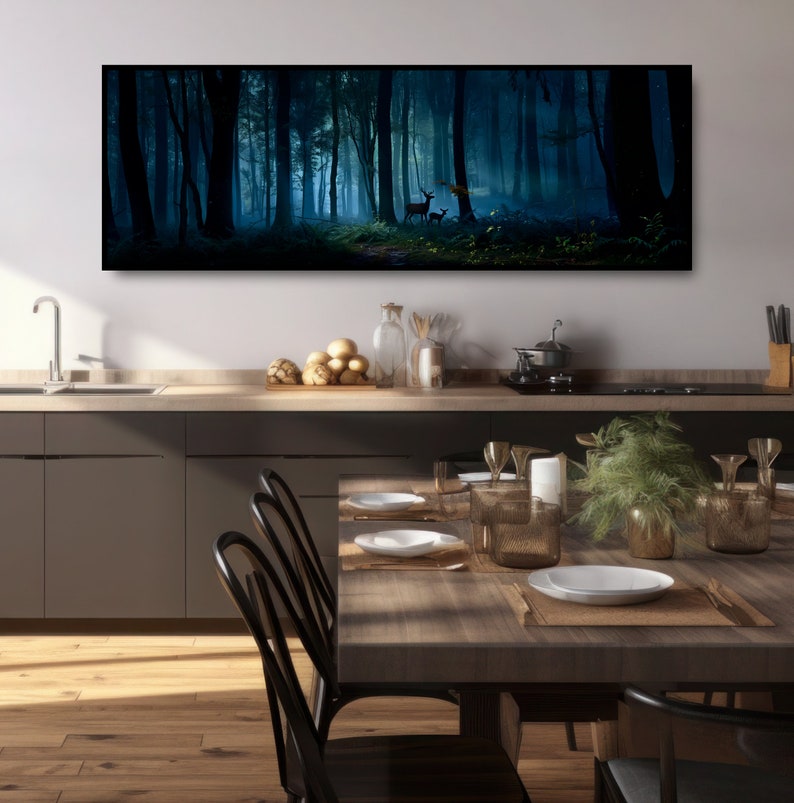 May include: A long, rectangular canvas print depicting a dark, misty forest scene. Tall, silhouetted trees frame a path leading to a bright, ethereal clearing. Two deer stand near the light. The artwork is displayed above a kitchen counter and dining table.