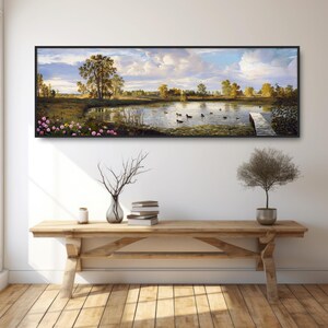 May include: A panoramic landscape painting depicting a lake with ducks swimming in the water. The lake is surrounded by trees and a wooden dock. The sky is blue with white clouds.