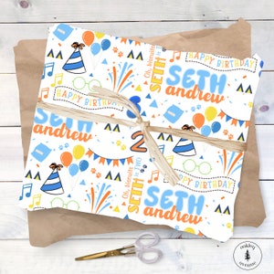 May include: White wrapping paper with a colourful pattern of musical notes, fireworks, balloons, party hats, and paw prints. The text "Happy Birthday Seth andrew" is repeated throughout the design.