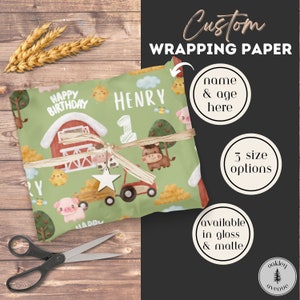 May include: Custom wrapping paper with a farm theme. The paper features a red barn, a pig, a cow, a tractor, and a chick. The text "Happy Birthday Henry" is printed on the paper. The paper is available in three sizes and in gloss or matte finishes.