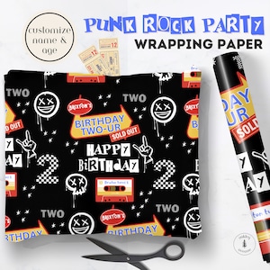 May include: Black wrapping paper featuring a punk rock theme with white skull faces, red cassette tapes, checkered number twos, hand signs, and yellow signs reading Birthday Two-ur Sold Out. The design includes the text Happy Birthday and Brixton.