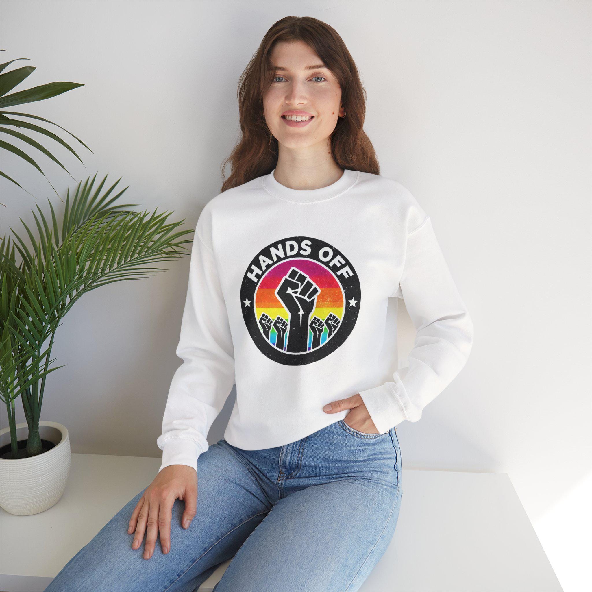 Hands Off Pride Crewneck Sweatshirt | Rainbow Protest Graphic LGBTQ+ Rights & Social Justice | Raised Fist Design Sweatshirt | Anti-Trump