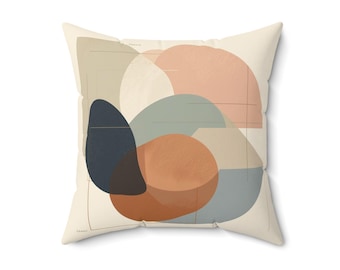 May include: Square throw pillow with an abstract design. The pillow features overlapping shapes in muted colors: beige, peach, navy, rust, and gray. Thin black lines intersect the shapes. The pillow is a neutral color, and the design is modern.