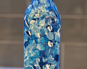 botella de vidrio pintada a mano