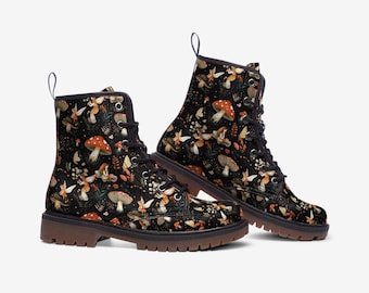 May include: Black leather lace-up boots with a whimsical pattern of fairies and mushrooms. The boots have a brown rubber sole.
