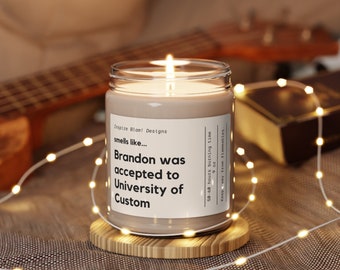 May include: A brown candle with a white label that reads "Inspire Blan! Designs smells like... Brandon was accepted to University of Custom 50-60 hours burning time 9oz Keep way from flammables."