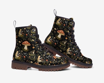 May include: Black leather lace-up boots with a dark floral print featuring fairies, mushrooms, and frogs.
