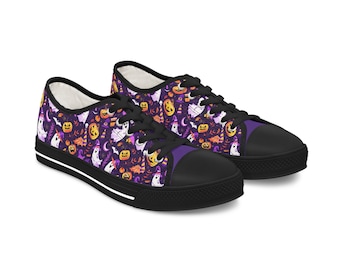 May include: A pair of black canvas shoes with a purple and orange Halloween-themed print featuring ghosts, pumpkins, and bats.
