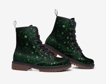 May include: Green and gold lace-up boots with a shamrock pattern. The boots have a black sole and laces.