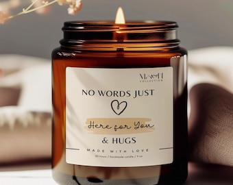 May include: A brown glass candle jar with a white label that reads "NO WORDS JUST ♡ Here for You & HUGS MADE WITH LOVE 50 hours/handmade candle/9 oz".