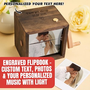 May include: A wooden flipbook music box with a photo of a couple kissing. The box has a crank and a small gold button. The text "I love you always 22.07.2025" is engraved on the top. The red banner reads "ENGRAVED FLIPBOOK - CUSTOM TEXT, PHOTOS & YOUR PERSONALIZED MUSIC WITH LIGHT".