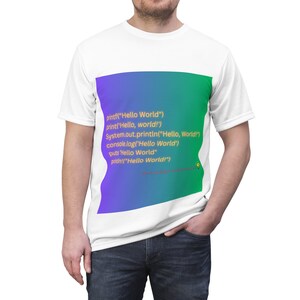 May include: A white t-shirt with a colorful gradient background featuring code snippets for printing "Hello World!" in different programming languages.