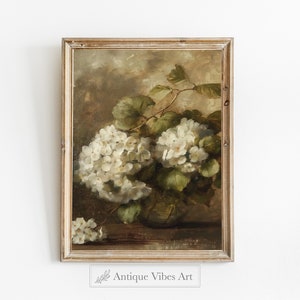 May include: A framed painting depicting white hydrangeas in a vase with green leaves. The painting has a vintage feel and is displayed against a white background.