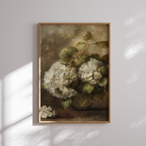 May include: A vintage oil painting depicting a bouquet of white hydrangeas in a clear glass vase. The flowers are arranged in a loose, natural style, and the painting has a soft, romantic feel.