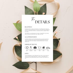 May include: A white wedding invitation card with black text detailing the reception, accommodation, and order of the day. The card includes icons for the ceremony, cocktail hour, dinner, and dancing. The text reads "The Details", "Reception", "Accommodation", "Order of the Day", and "Gifts".