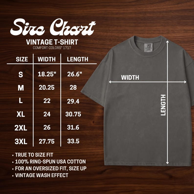 May include: A size chart for a vintage t-shirt, with measurements in inches. The chart includes sizes S to 3XL, with width and length dimensions. The shirt is a dark gray color, and the text on the chart is white.