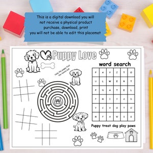 May include: Black and white puppy-themed placemat with the words "Puppy Love" and various activities. Includes a word search, maze, tic-tac-toe, and illustrations of puppies, paw prints, a dog bone, and a dog house.