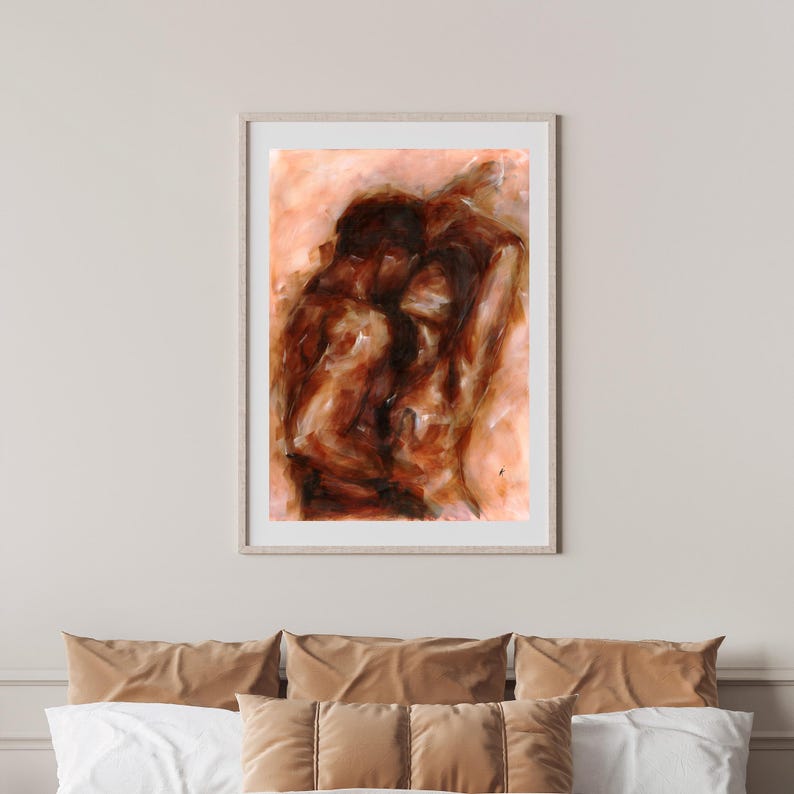 May include: Abstract painting in a light wood frame. The artwork depicts two figures in shades of brown and orange, with visible brushstrokes. The painting is mounted above a bed with brown and white pillows.