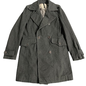 May include: A dark grey double-breasted wool coat with a classic collar and flap pockets.