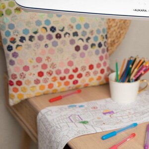 May include: White desk lamp with a long, adjustable arm and a rectangular light fixture. The lamp is on a wooden table with a white drawing pad and colored pencils.