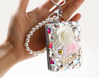 Small rectangular silver mirror, used in makeup to enlarge the face, embellished with diamonds and pearls