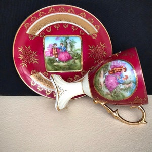 Antike Sockel Fuß Tasse und Untertasse. Import signierte Kaffee Tasse mit Untertasse, Fragonard Scenes