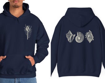 May include: A navy blue hoodie with a white seashell design on the front and three white seashells on the back.