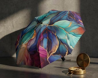 Ombrello astratto con effetto fluido - Ombrello da pioggia compatto e pieghevole con motivo blu petrolio e oro, parasole da viaggio colorato