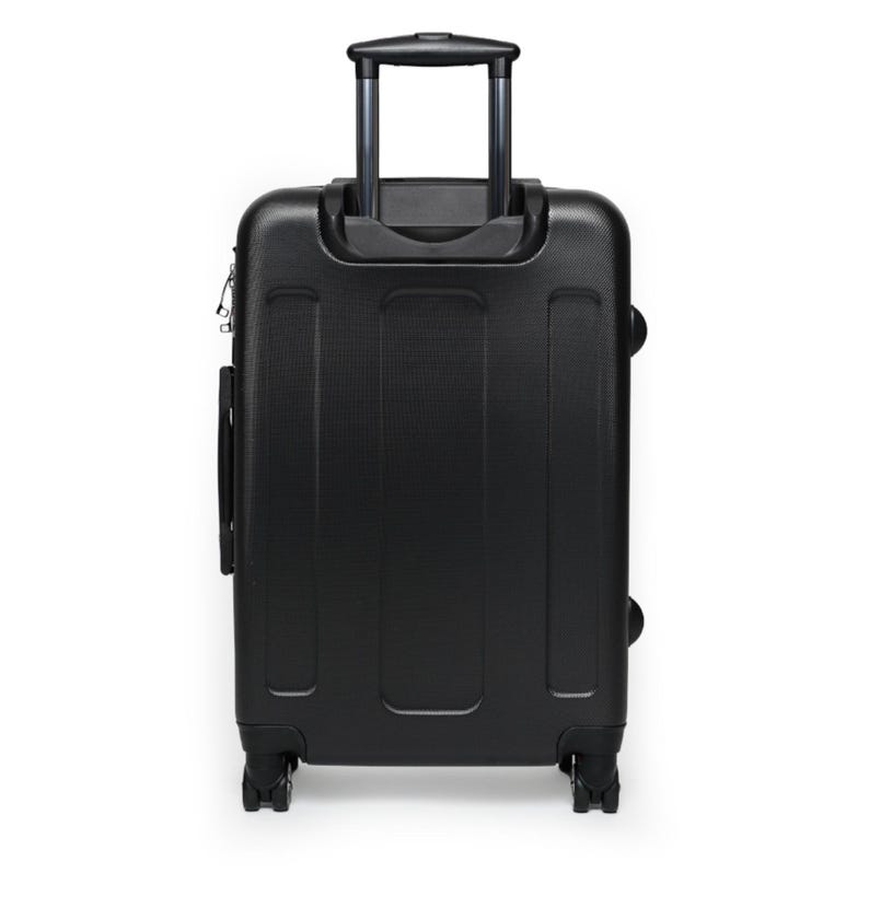 May include: Black suitcase with a retractable handle and four wheels. The suitcase is made of hard-sided material.