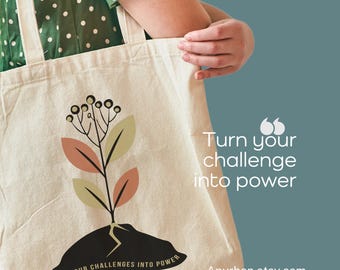 Bolsa de lona, ilustración con frase de una planta resiliente en tonos tierra, bolsa de compras ecológica, transforma los desafíos en poder, inspiradora