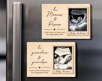 May include: Two wooden pregnancy announcement magnets. One reads "Hi Mamaw & Papaw" with a sonogram image and "I can't wait to meet you! due November 2026." The other says "Hi grandma & grandpa" with a sonogram and "I can't wait to meet you! due September 2026."