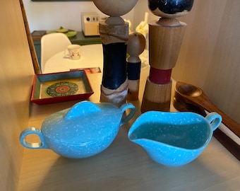 Cool mcm design melamine smallish lidded sugar bowl and creamer. Aqua speckled finish. Normal vintage wear.