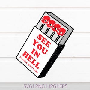 May include: A white matchbox graphic with black outlines containing four matches with red skull-shaped heads. The text reads SEE YOU IN HELL in red capital letters, followed by the smaller red text HANDLE WITH CARE below the main phrase.