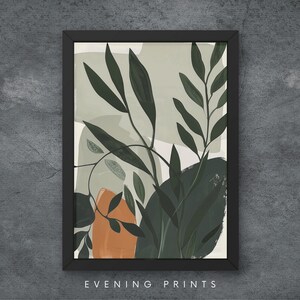 Puede incluir: Impresión de arte abstracto con un esquema de color verde y naranja con una representación estilizada de hojas y ramas. La impresión está enmarcada en un marco negro.