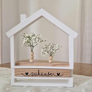 Casa in ceramica con elementi in legno