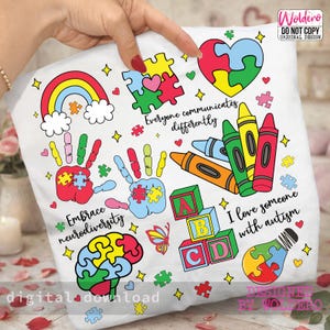 May include: White pillowcase featuring colorful illustrations related to autism awareness. Designs include a rainbow, puzzle pieces, handprints, crayons, building blocks, and the text "Everyone communicates differently," "Embrace neurodiversity," and "I love someone with autism."