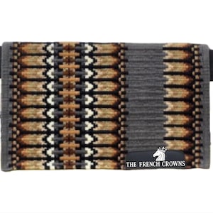 May include: A gray and tan saddle pad with a geometric pattern. The pad features a central design of repeating shapes in tan, brown, and white, bordered by solid gray sections. The text "THE FRENCH CROWNS" is visible on the pad.
