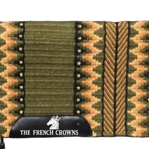 May include: Olive green and tan saddle pad with a geometric pattern. The pad features a central vertical stripe and a black leather patch with the text "THE FRENCH CROWNS".