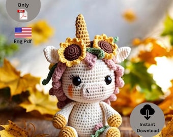 May include: A crocheted unicorn doll with a sunflower crown and a horn. The doll is white with pink and yellow accents. The image includes the text "Unicorn Pattern" and "Eng Pdf".