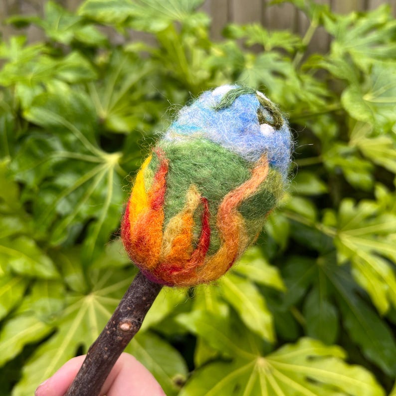 Close up view of Beltane Beater head showing fire and earth motif