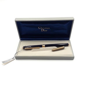 Pluma estilográfica vintage de lujo Christian Dior dorada, fabricada en Suiza. Logotipo del CD.