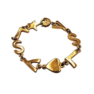 Bracelet Jenny D'Ormond à breloques vintage - années 80/90 Doré Métal