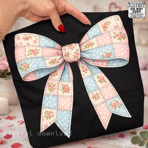 May include: A black tote bag featuring a large bow design. The bow is a patchwork of pink and blue squares with white polka dots and floral accents. The bow is centered on the bag, and the design is a digital download.