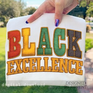 May include: White t-shirt with the words "BLACK EXCELLENCE" in large, colorful, embroidered letters. The design includes red, yellow, green, and black lettering with a brown outline. The words "digital download" and "DESIGNED BY RIPPENT" are also visible.