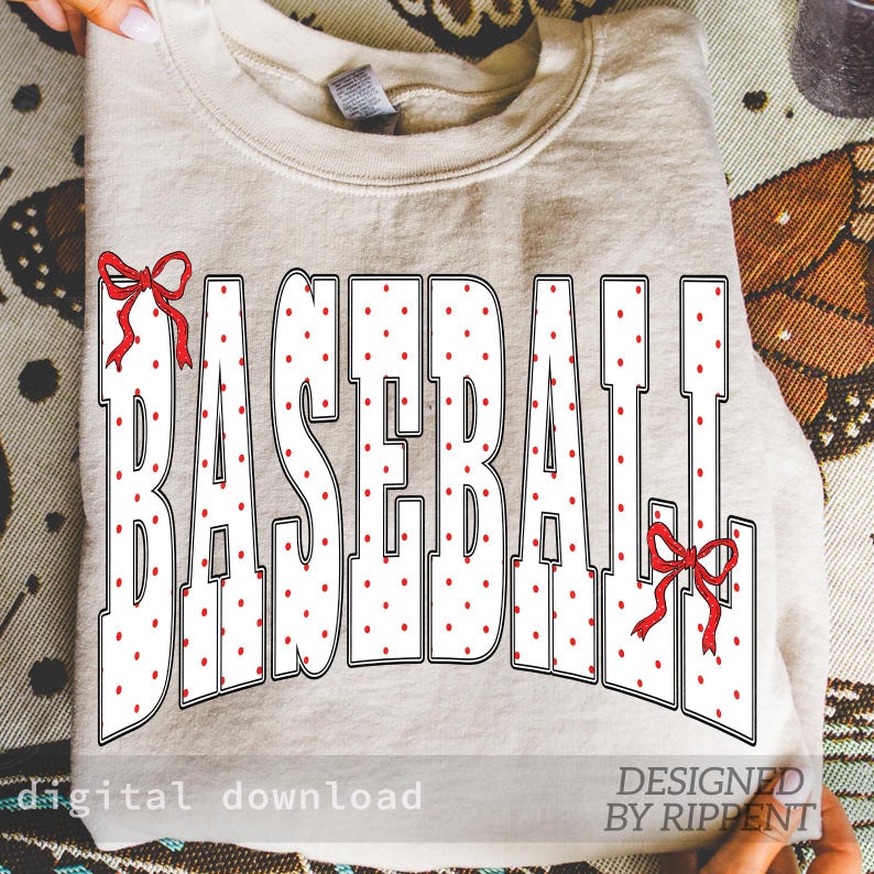 May include: A beige sweatshirt with the word "BASEBALL" in large white letters with red polka dots. Red bows accent the top of the letters. The words "digital download" and "DESIGNED BY RIPPENT" are at the bottom.