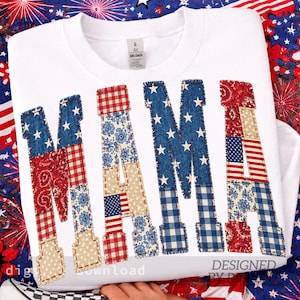 May include: White sweatshirt with the word "MAMA" in patchwork letters. The letters feature patriotic patterns like stars, stripes, and paisley in red, white, and blue. The design is a celebration of American pride.